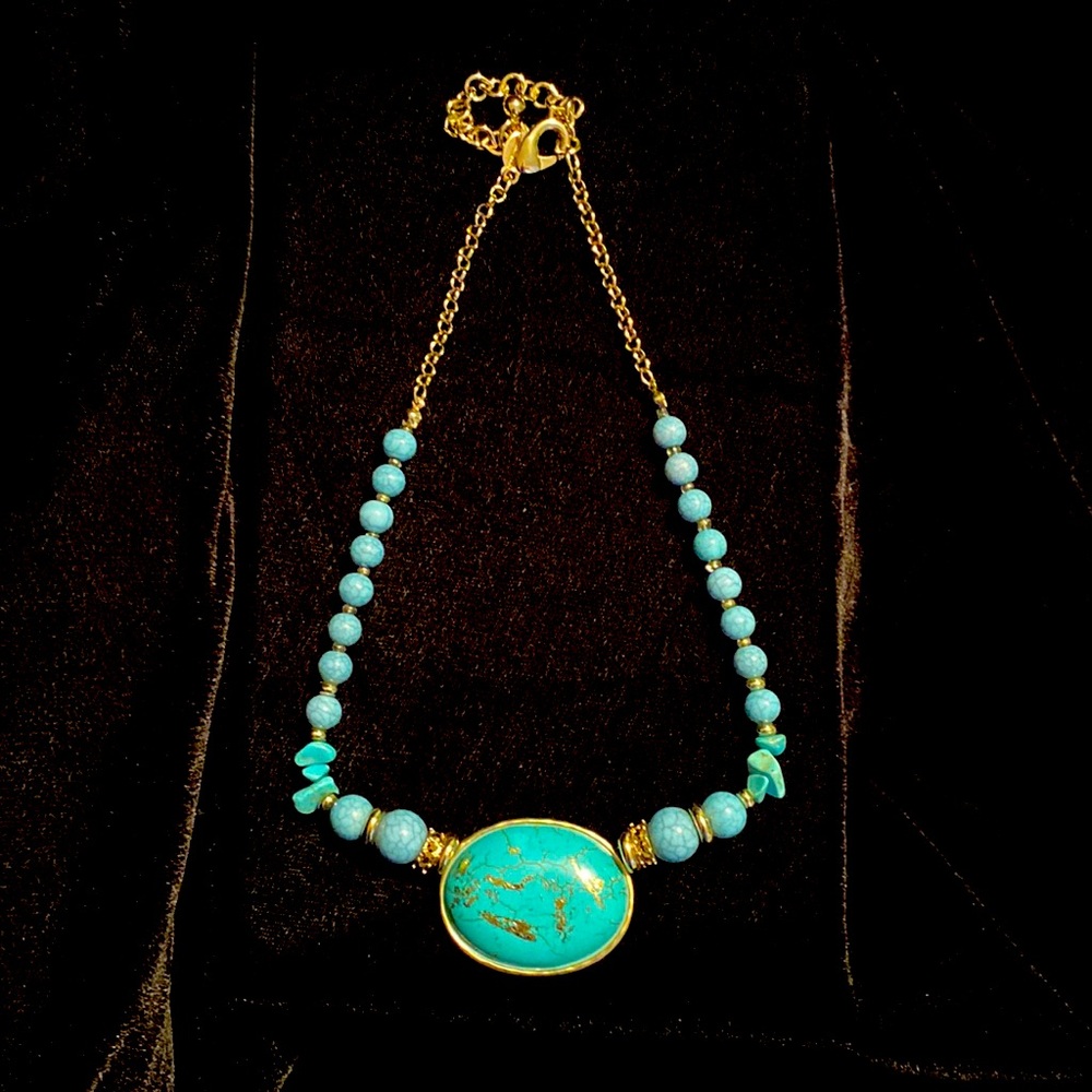 Chico’s faux turquoise and gold trim necklace.